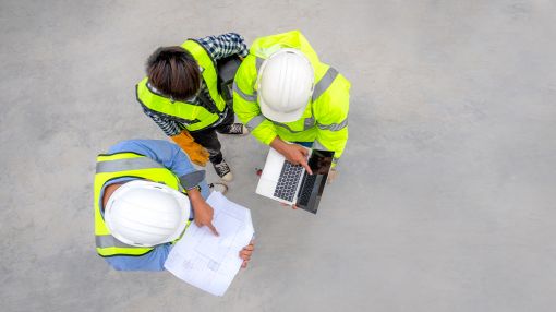 Image of the construction workers planning a project.